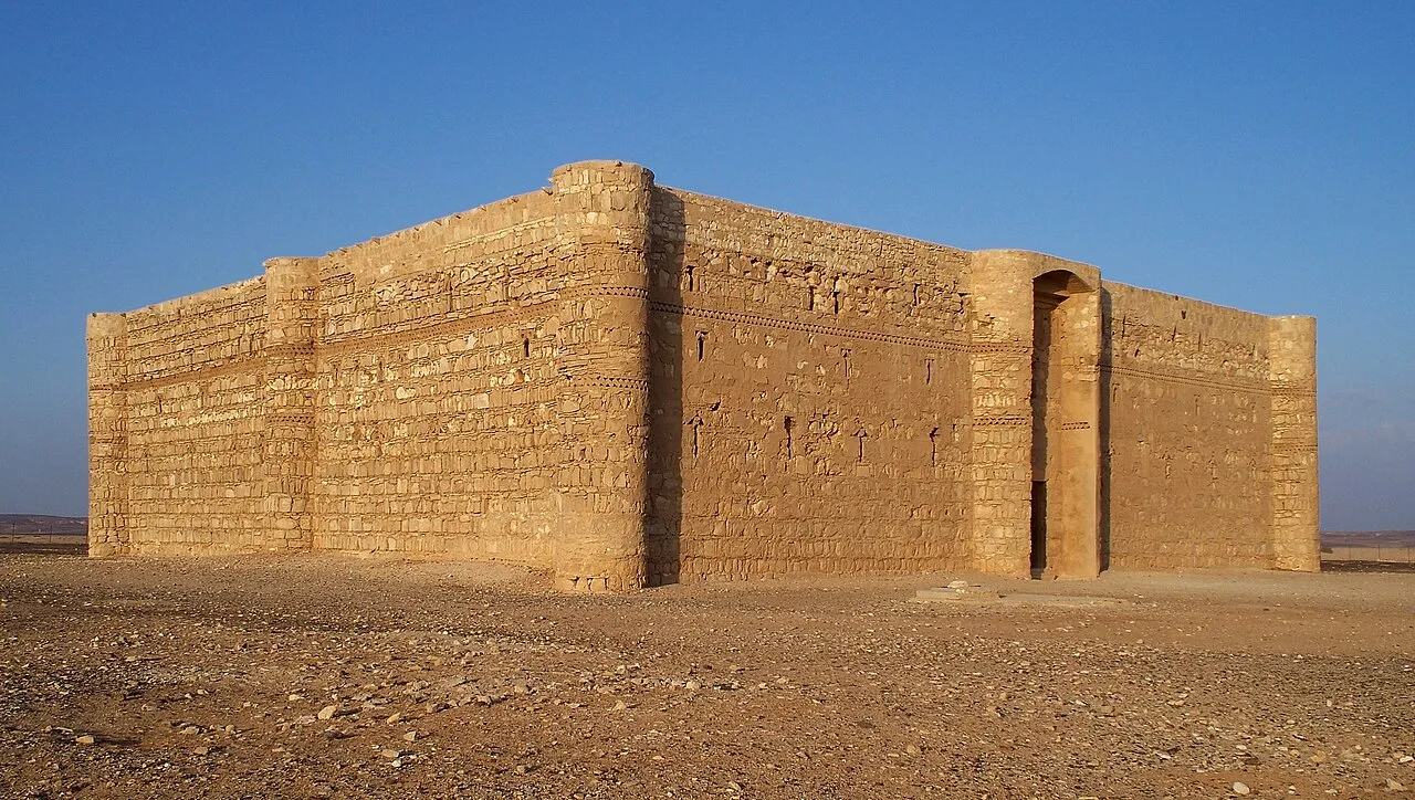 The square stone walls of Qasr Kharana in the desert