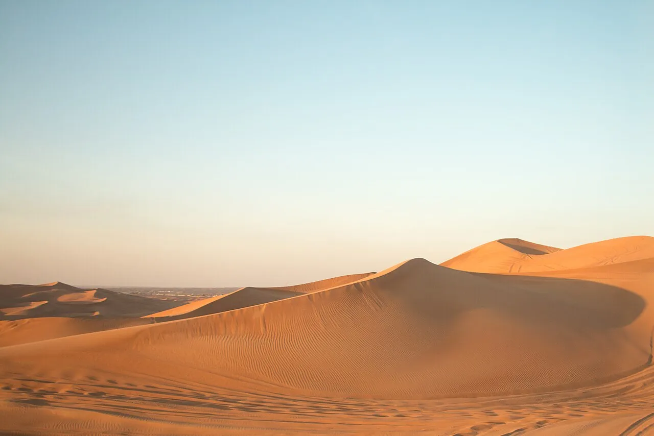 Golden sand dunes in the desert outside Dubai
