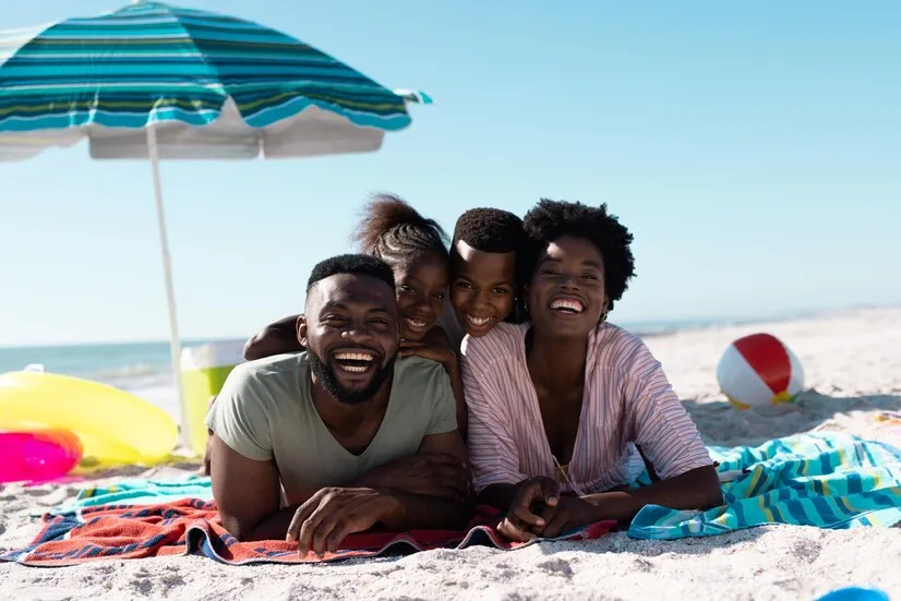 A family walking together along a beach